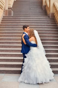 Newlyweds on a walk in the park on a warm sunny day