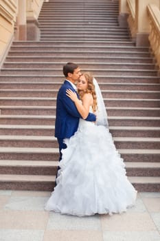 Newlyweds on a walk in the park on a warm sunny day