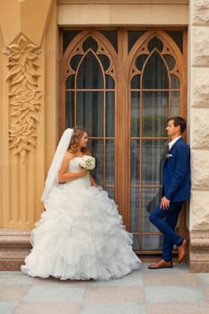 Newlyweds on a walk in the park on a warm sunny day