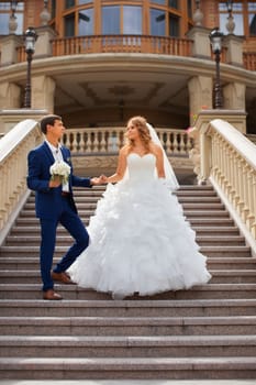 Newlyweds on a walk in the park on a warm sunny day