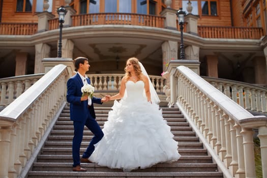 Newlyweds on a walk in the park on a warm sunny day