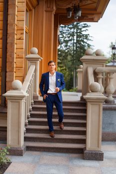 Portrait of the groom in an expensive suit