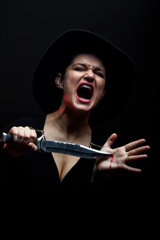 screaming girl with knife and blood on her hands