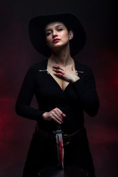 girl with a huge bloody knife, red smoke background