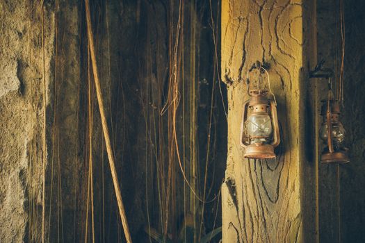 Kerosene lamp on wooden door background