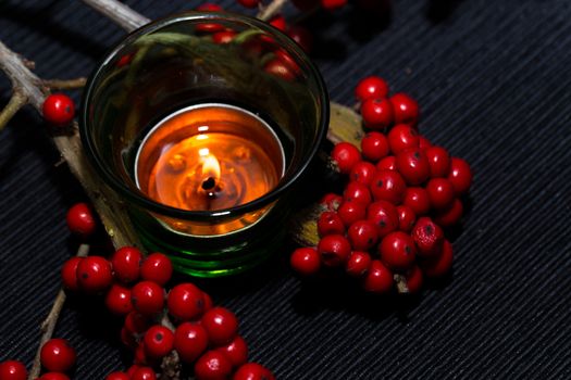 candle,ashberry and box on the black backgraund