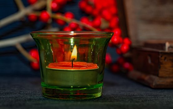 candle,ashberry and box on the black backgraund