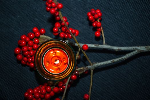 candle,ashberry and box on the black backgraund