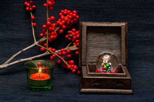 candle,ashberry and box on the black backgraund