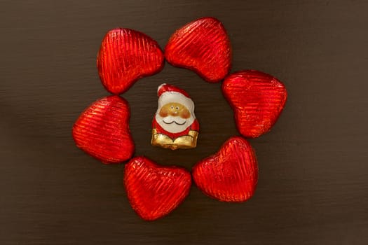 composition of red hearts and Santa Claus