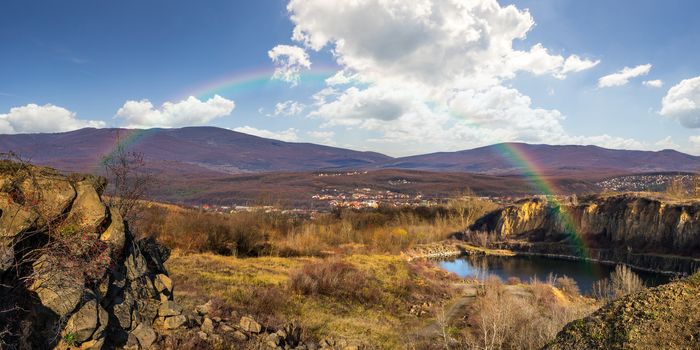 collage of small lake in an abandoned stone quarry in the mountains outside the city with rainbow in morning light