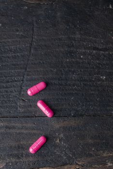 Pills and medicine over a dark table and backrgound.
