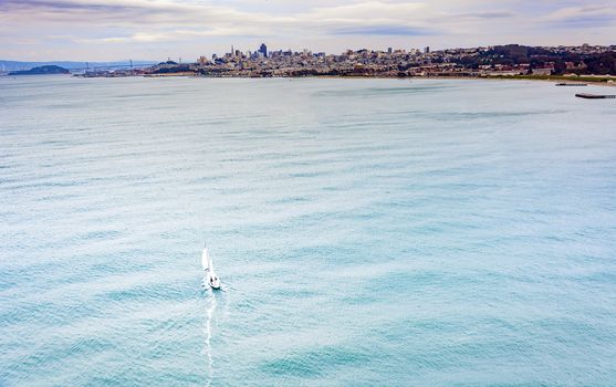 boat sailing moving to the city of San Francisco