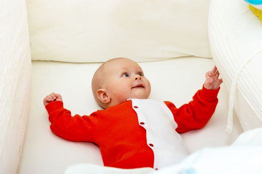 Close up shot of boy newborn in cot