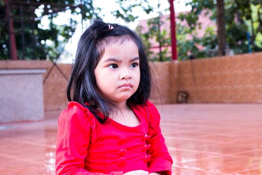 Pretty girl sitting alone