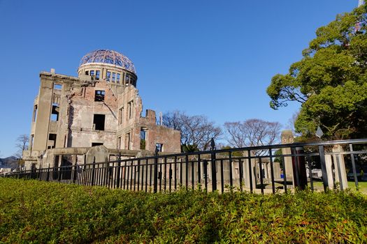 View of Atomic Bomb Dome (Genbaku) at sunny day. The Hiroshima Peace Memorial was the only structure left standing in the area where the first atomic bomb exploded on 6 August 1945.