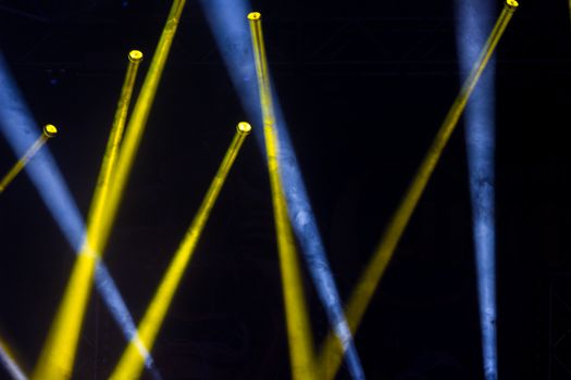 Colorful lights and smoke on a stage.