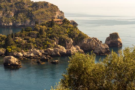 View of island and Isola Bella and blue ocean water in Taormina, Sicily, Italy