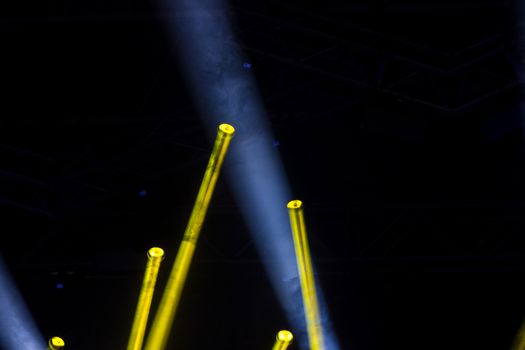 Colorful lights and smoke on a stage.