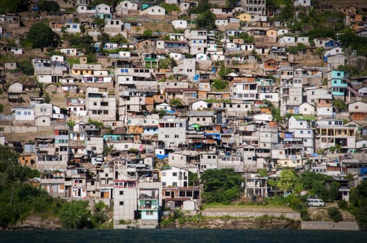 Crowded white houses on a mountain side in Guatemala