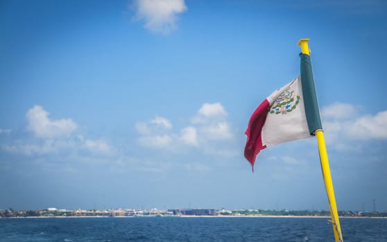 Mexican flag on a beach