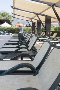 A Lounge sunbeds near a swimming pool