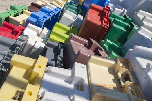 Colourful collection of old exhibited plastic crates
