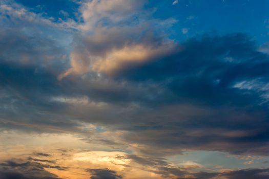 Sunset with partly cloudy sky. Dramatic sky