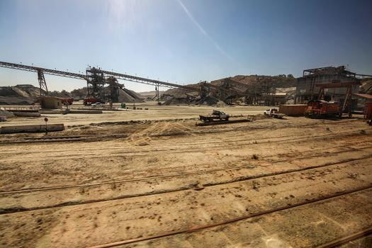 A construction site with a lot of dirt and travelators