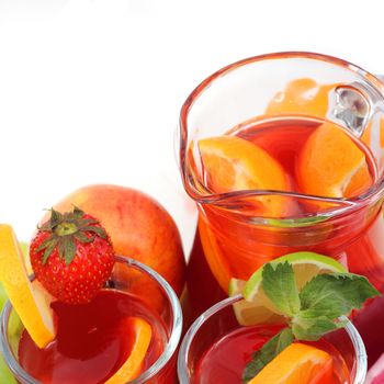 Jar of summer juice lemonade juice or sangria with fruits isolated on white background