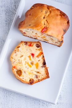 Homemade Fruit Cake with raisins on a white plate