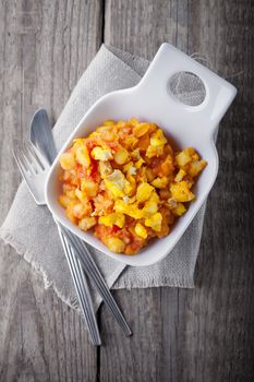 Healthy lunch with cod and steamed vegetables, pumpkin, potatoes and saffron