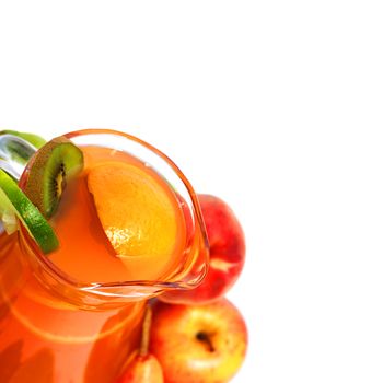 Jar of juice and mixed pile of vegetables isolated on white background