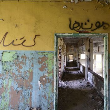wide angle view of an old wall abandoned factory building