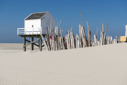 Famous sea cottage on the sandbar the Vliehors on the wadden Island Vlieland in the Netherlands
