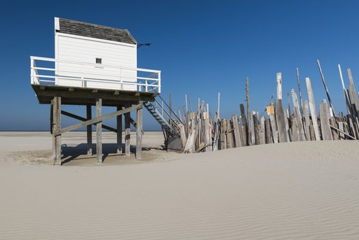 Famous sea cottage on the sandbar the Vliehors on the wadden Island Vlieland in the Netherlands
