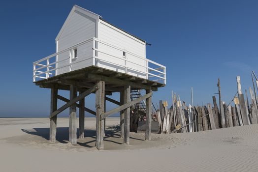 Famous sea cottage on the sandbar the Vliehors on the wadden Island Vlieland in the Netherlands
