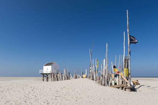 Famous sea cottage on the sandbar the Vliehors on the wadden Island Vlieland in the Netherlands
