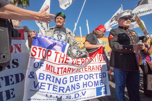 NOGALES, AZ - OCTOBER 08: Veterans with banners forming a march during border policy protest march on October 08, 2016 in Nogales, AZ, USA.