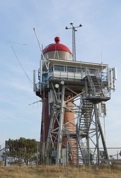 The cast iron lighthouse on the wadden Island Vlieland, near the village Oost-Vlieland located on the so called Vuurboetsduin in the Netherlands
