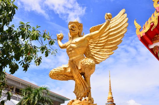 A statue of a golden Garuda, a bird like creature common in both Buddhism and Hinduhism