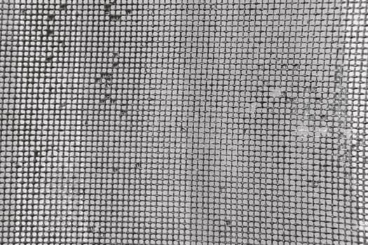 Old rusty mesh in blurring. Colorful pattern. Metal rusty fences.