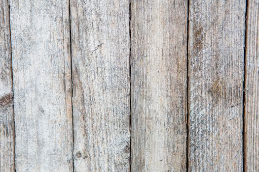 Cracking and peeling paint on a wall. Vintage wood background with peeling paint. Old board with Irradiated paint