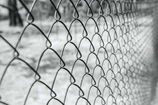 Old rusty mesh in blurring. Colorful pattern. Metal rusty fences.