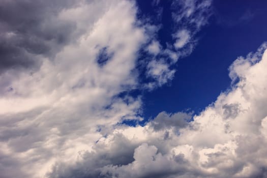 Abstract background, blue sky with clouds close-up