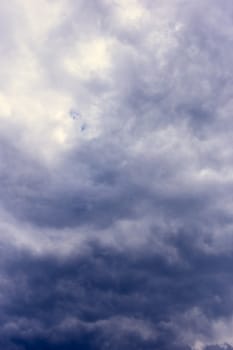 Abstract background, dark sky with clouds close-up
