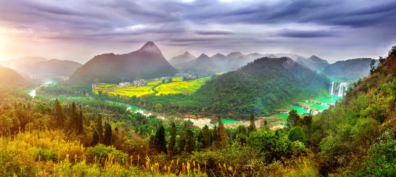 Panorama of Jiulong waterfall at sunset in Luoping, China.