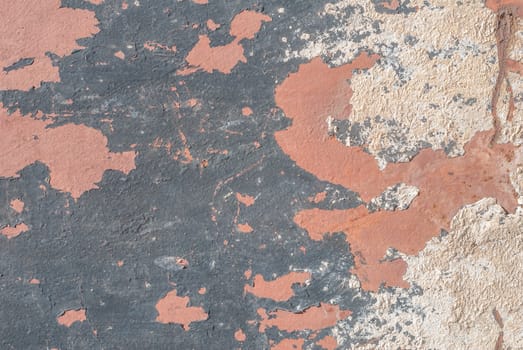 fragment of an iron surface is covered old paint, which has long been under the influence of different climatic conditions
