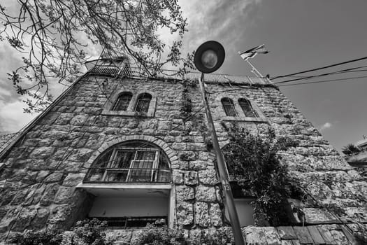 Jerusalem, old house in the center of the city with Israeli flag