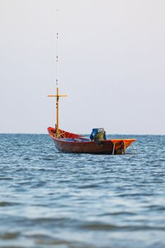 Image of small boat fishing on the sea.